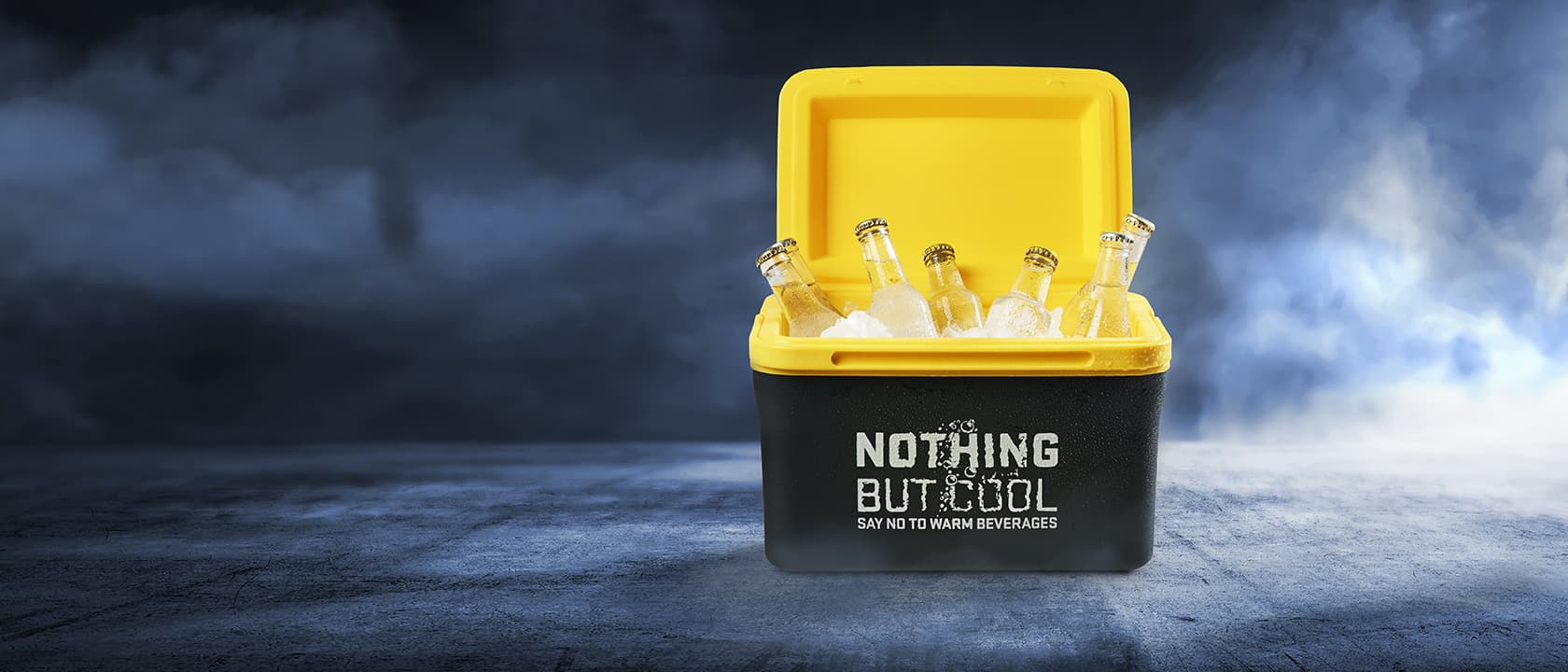 A black and yellow cooler box with the text "Nothing but cool" on it